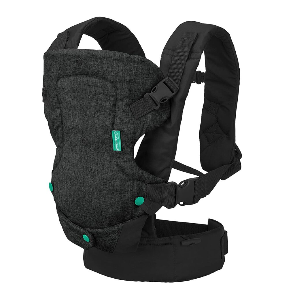 A black infantino baby carrier with a white background. 